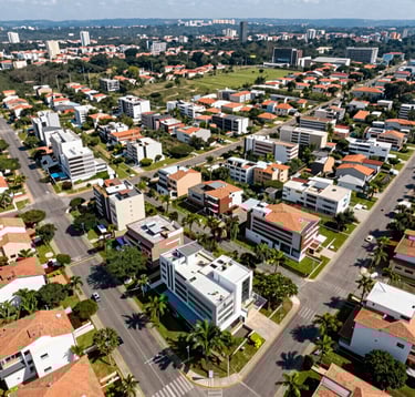 An aerial photography of a high-end gated community in Barueri, showcasing luxury residences with modern architecture, wide paved streets, and abundant green areas typical of the Brazilian South American premium suburban landscape, bright daylight lighting.