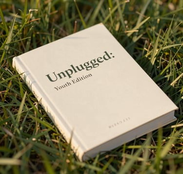 A close-up of a high-quality physical devotional book titled 'Unplugged: Youth Edition' resting on green grass. The sunlight is warm and soft #F4A261, highlighting the clean, modern typography of the cover. A sense of hope and spiritual growth.