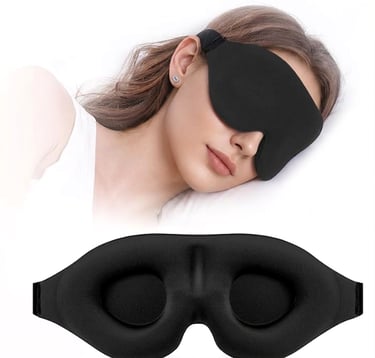 Woman wearing a black 3D contoured sleep mask for total light blocking and better sleep.