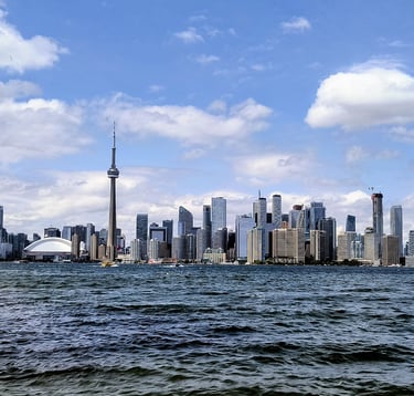 Toronto skyline showing Houses, Condos, Commercial buildings, lake front, legal contracts and land