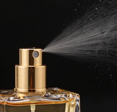 Close-up macro photography of a gold-toned perfume atomizer emitting a fine, deliberate spray. The backdrop is a solid obsidian black. The focus is sharp on the metal texture and the frozen droplets of the mist. Precise, luxury fragrance marketing style.
