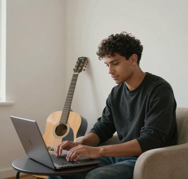 An independent musician working on a laptop in a brightly lit, minimalist home studio with off-white walls. A guitar leans against a soft sand-colored chair. The scene is clean, empowering, and modern.