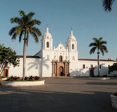 Wide-angle photography of a historic South American colonial plaza with pearl white architecture, lush green palm trees, and elegant shadows during a bright afternoon, conveying a sense of heritage and peace.