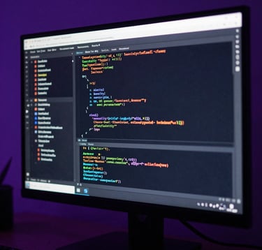 A macro photograph focusing on a high-definition monitor displaying sophisticated programming code. The room is dimly lit with deep purple and dark navy ambient lighting, creating a high-tech and innovative atmosphere. North American / Global Professional.