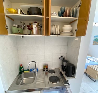 a kitchen with a sink and a microwave