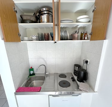 a kitchen with a sink and a stove top