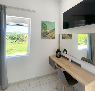 a desk with a mirror and a television