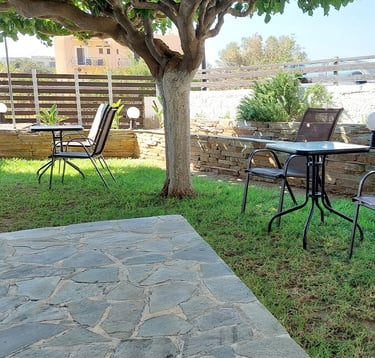 a table with chairs and chairs in a yard