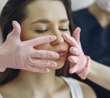 masafing face with pink gloves side by side