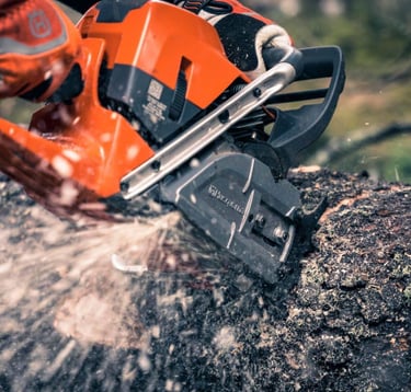 chainsaw cutting a log
