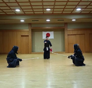 a group of people in uniform practicing kendo