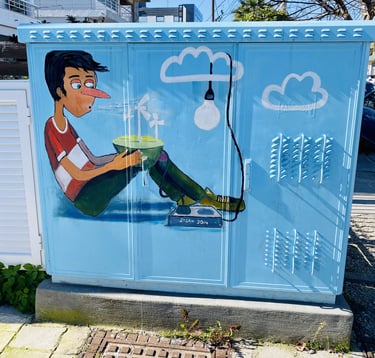 a blue box with a cartoon character painting on it in Rhodes Greece street art