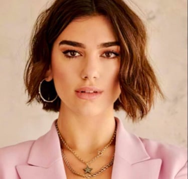 a woman with a pink jacket and a necklace