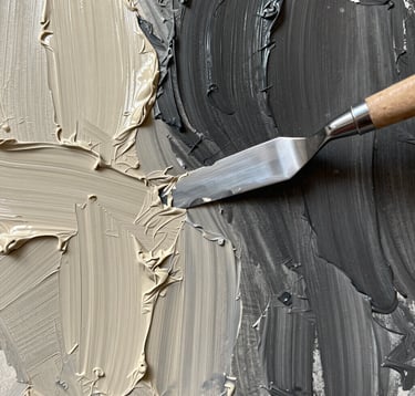 A detailed macro shot of contemporary abstract artwork, showcasing rich textures of charcoal and warm ivory oil paint applied with a palette knife. The lighting captures the depth of the ridges and the matte finish of the muted earth tones. Minimalist and editorial style.