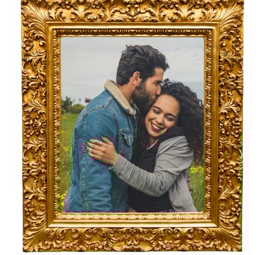 a couple embracing each other in a golden frame