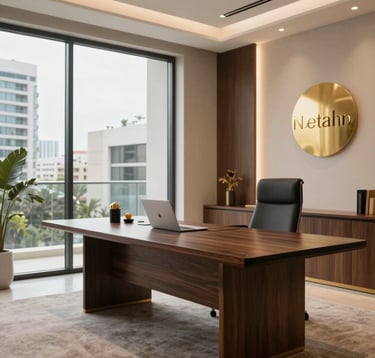 A sophisticated, professional consultation room in a private wealth advisory firm in Israel. A large dark wood table and a view of modern Netanya architecture through a glass wall. The lighting is soft and warm, highlighting gold details. Minimalist and elite.
