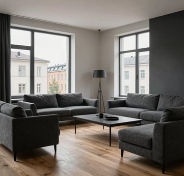A high-end minimalist living room in a Baltic apartment with light oak flooring and charcoal gray furniture, large windows showing a clean urban background.