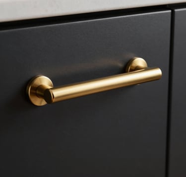 Extreme close-up photography of a champagne gold kitchen handle against a matte black cabinet door. Precision craftsmanship, architectural detail, luxury materials. Soft studio lighting, North American / Californian aesthetic.