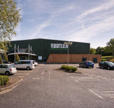 Exterior of Lord Butler Leisure Centre in Saffron Walden with parking and entrance