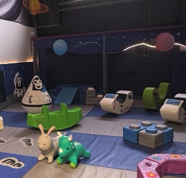 JustPlay baby and toddler softplay section with soft rockers wall puzzles hoppers and foam slides