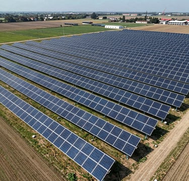 A sprawling solar energy farm integrated with agricultural land in a Global / Emerging Markets region. The photography is modern and high-resolution, captured from an aerial perspective to highlight large-scale project finance and sustainable infrastructure.