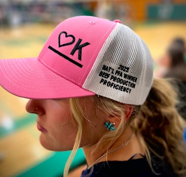 Kyelynn Coombe wearing her Heart K Branded Baseball Cap