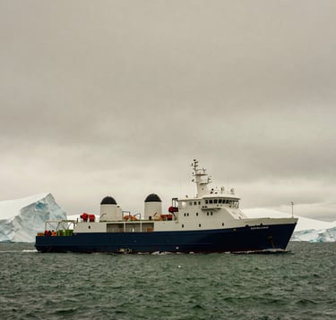 Minimalist photography of a sleek, eco-conscious research vessel navigating the deep olive waters of the Antarctic. The icebergs are ivory and grey against a taupe sky. The scene is spacious, evocative, and conveys a sense of high-end scientific exploration. Global / Discerning English-speaking.