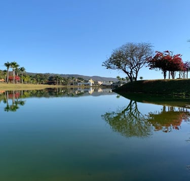 a lake with a clock tower in the background