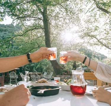 two people toasting with greek wine at a table