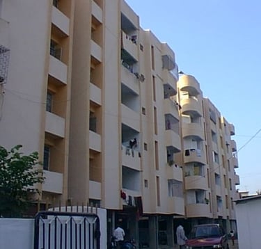 a building with a lot of windows and a lot of people walking by