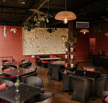 a restaurant with wicker chairs and tables