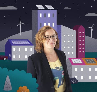 Women sits in front of an illustrated scene of colourful a town with hills and wind turbines.