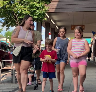 A small boy in tears walking down Broadway in Wisconsin Dells