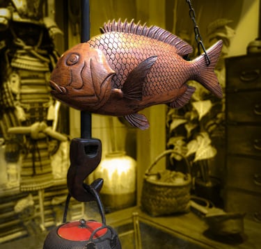 Expert evaluating authenticity of a Japanese piece