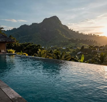 A luxury resort infinity pool overlooking lush tropical mountains in Bali at sunset, sophisticated and peaceful, with deep charcoal teal and soft sky blue highlights, in a Global / English-speaking luxury setting.