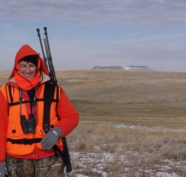 Miss Pauline enjoying winter hunting in Cascade Montana with Square Butte as a backdrop