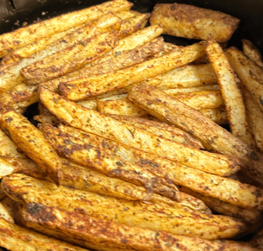 Seasoned air fryer fries, cooked and ready to eat.