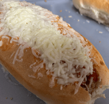 Turkey Meatball sub with melted cheese on top.