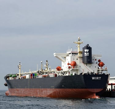 A professional photography shot of a large oil tanker at a modern offshore terminal under a silver-gray sky. The lighting is crisp and detailed, emphasizing the scale of global energy logistics. Global/International setting.