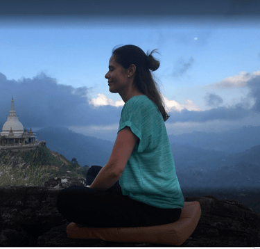 A lady is meditating at Mahamevunawa Asapuwa in Nuwara Eliya