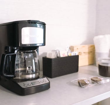 a coffee maker on a counter top with a coffee maker