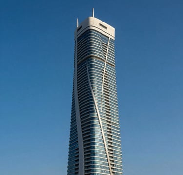 A vertical photography shot of the twisting Cayan Tower against a clear deep blue sky in Dubai Marina. The composition emphasizes the scale and innovative engineering of the building. Clean, modern, and professional Middle Eastern / Gulf urban setting.