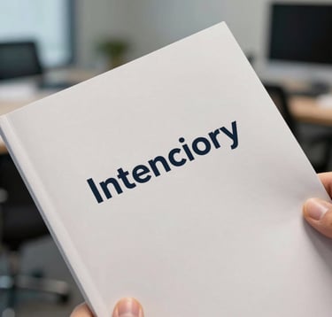 A detailed macro photograph of a high-quality, matte-finished brand manual or professional portfolio piece held by a person in an International / Western business setting. The focus is sharp on the paper texture and clean typography. The background is a soft-focus office with muted steel blue and crisp off-white tones.