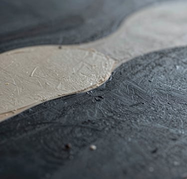 A close-up, macro shot focusing on the intricate details of a painted surface. The colors include deep #1A1A1A and soft #C8C0B2. The lighting is moody and dramatic, showcasing the deep personal storytelling of the artist's technique. The composition is modern and artistic, emphasizing the physical nature of the medium.