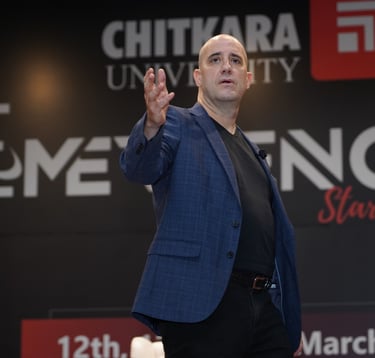 Ashwin Mushran speaking on stage