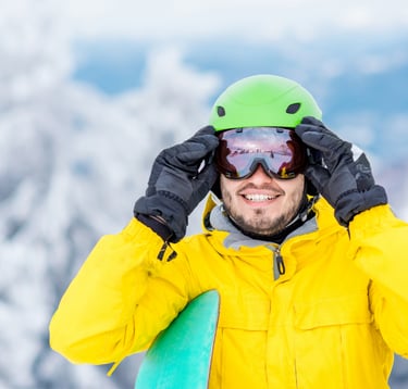 Man climbing a mountain with athletic eyewear