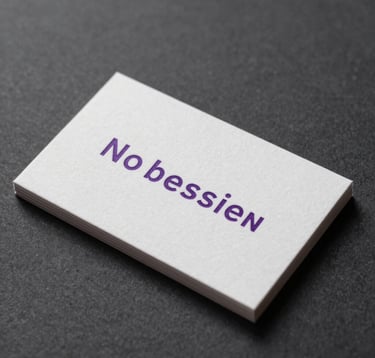 Close-up of a premium, minimalist business card design on a Dark Charcoal textured surface, Macroon Purple ink details, sophisticated North American executive aesthetic, soft studio lighting.