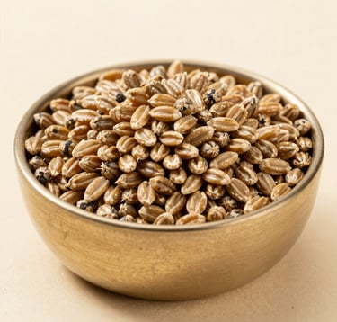 A close-up photograph of high-quality, proprietary livestock feed grains in a clean metallic gold bowl. The lighting is bright and professional, emphasizing the purity and controlled nature of the nourishment, set against a pale cream background.