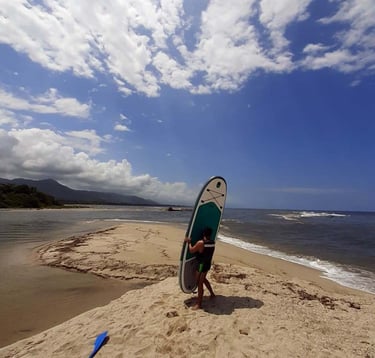 Paddle board at Don Diego River near Tayrona Park in Colombia