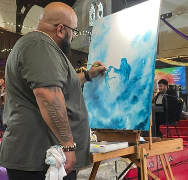 a man is painting a picture of Jesus healing the broken 